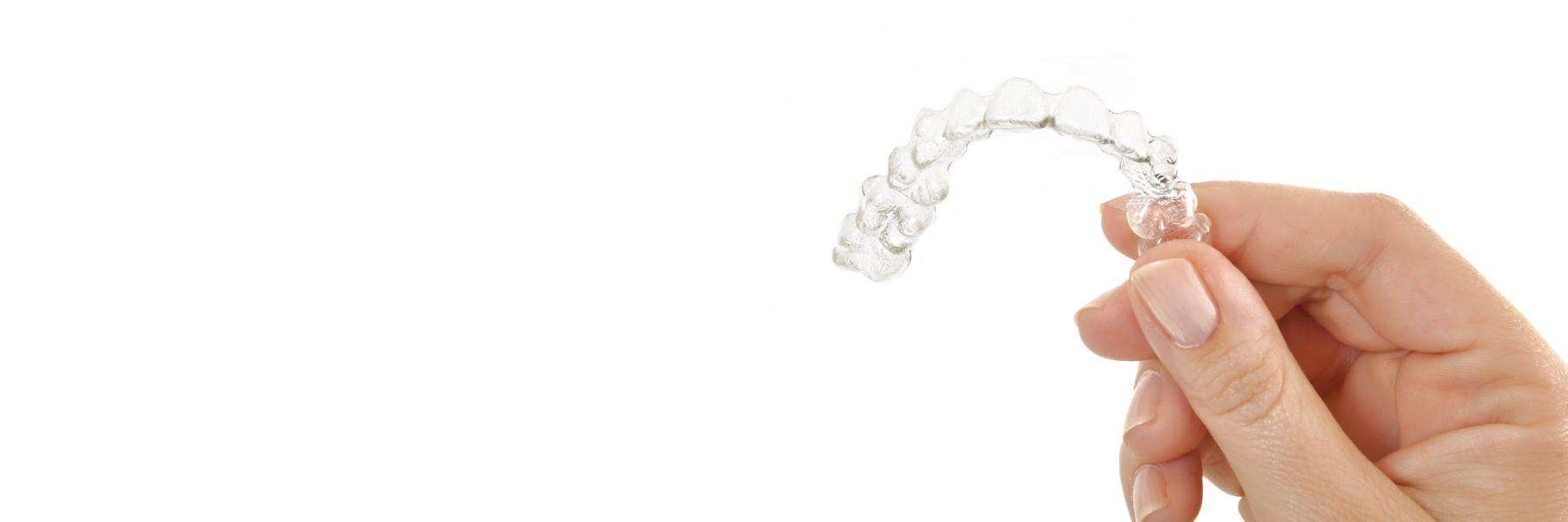 An image showing Invisalign held at hand in Rutland, MA.