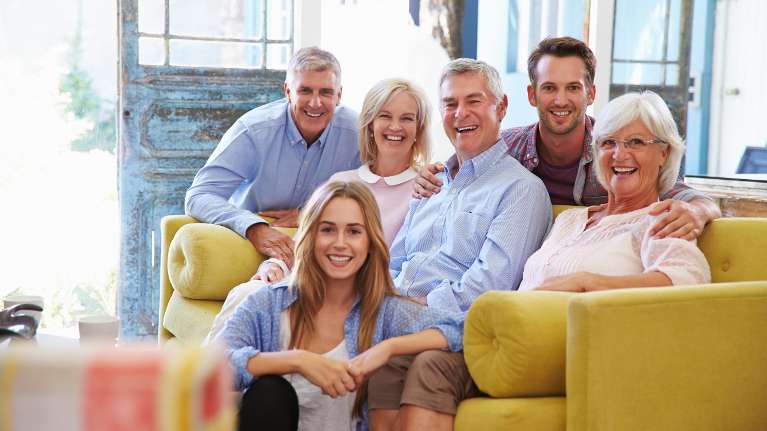 dentist holden | family sitting on couch