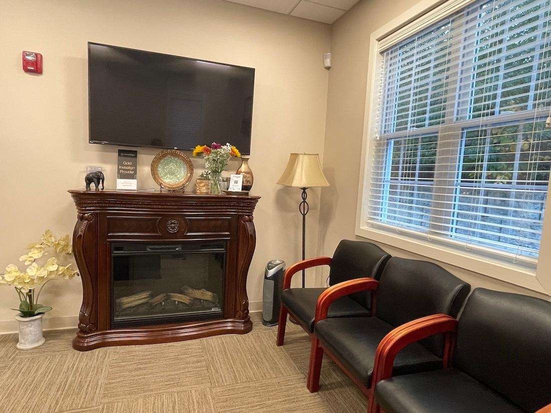 TV and Fireplace in Waiting Room Dentist in Paxton | waiting room